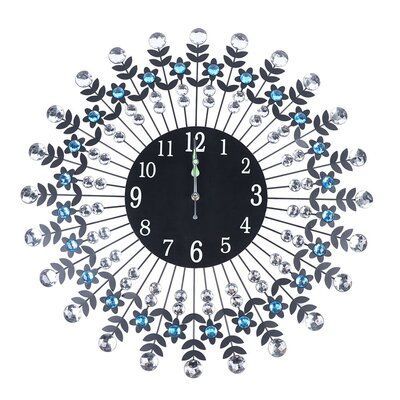 a black clock with blue and white flowers on it's face is surrounded by jewels