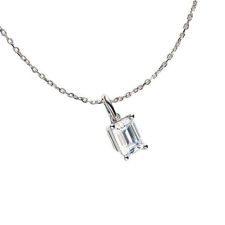 a necklace with a baguette cut diamond on the front and chain attached to it