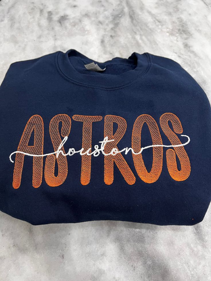 Embroidered Houston Astros sweatshirt.  Soft and warm Gildan sweatshirts (Heavy blend) Winter Crew Sweats With Embroidered Logo, Varsity Sweatshirt With Custom Embroidery For Fall, Custom Embroidered Sweatshirt For College Sports Season, Sporty Sweatshirt With Embroidered Text For Fall, Sporty Sweatshirt With Embroidered Text For Winter, Winter Sporty Sweatshirt With Embroidered Text, Sporty Fall Sweatshirt With Embroidered Text, Sporty Winter Sweatshirt With Embroidered Text, Game Day Crew Neck Sweatshirt With Embroidered Text