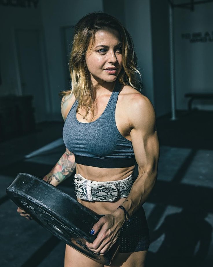 a female bodybuilding competitor posing for the camera