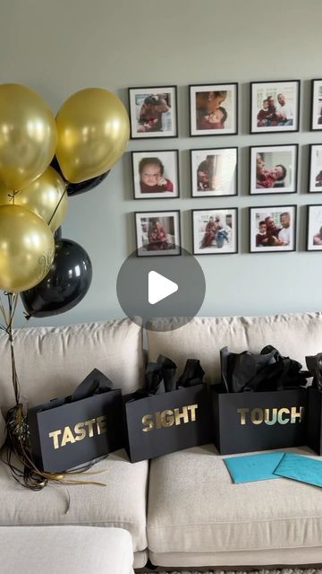 a living room filled with lots of balloons and presents on top of a white couch