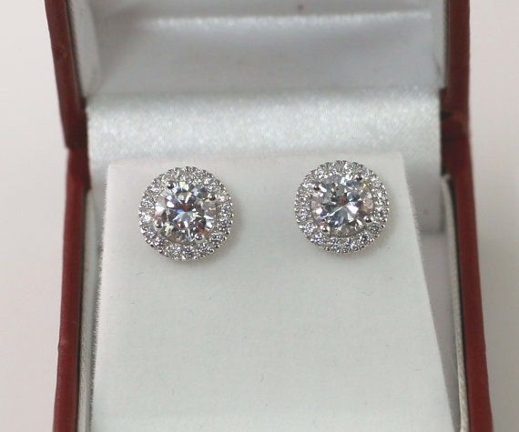 Showcased here is classic round halo studs earrings. Center set in round cut 1.0ct. There are also small stone halo set around the center stone. Great gift for yourself or for friends! ITEM SPECIFICATIONS: Metal Type: Solid 925 Sterling Silver Metal Stamp: 925 Plating: Rhodium Main Stone Dimensions: Round 6.5mm (1.0 carat) each Total Carat: Approx 2.32 total Dimension: Dimension with Halo approx. 10mm Stone: Flawless D Color (Cubic Zirconia Diamond Simulants) A note on shipping: If you PAID Ship Summer Wedding Jewelry, Small Gold Hoop Earrings, Wedding Silver, Diamond Shape Earrings, Small Gold Hoops, Round Halo, Open Hoop Earrings, Halo Earrings, Rare Crystal