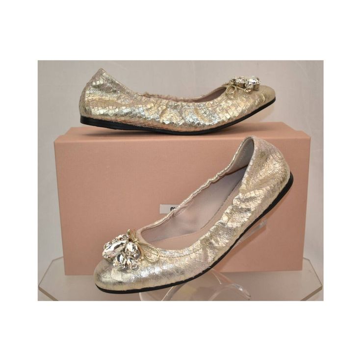 Pirite St Python Lamin Print Shimmer Lame Crystals Jeweled Bow Ballet Flats By Miu Miu Prada Made In Italy 100% Authentic, Guaranteed!!! Art:5f149c Color: Pirite (Print On The Box) St Python Print Lame Upper Round Toe Large Crystals Jeweled Bow Detail "Miu Miu" Stamped Leather Insole Leather Lining "Miu Miu" Stamped Logo Rubber Sole Elasticized Sides For Comfortable Fit Size 38 -Print On The Shoes And Box Original Price $750 Note!! These Shoes Came From A Prada Store In Its Original Box. They Are New But They Are In-Store Item And It’s Possible That Somebody Tried Them On Inside The Store. That Could Cause Tiny Exterior Imperfections Or Marks On Outsoles That Are Invisible W Chic Party Ballet Flats With Removable Insole, Party Ballet Flats With Branded Insole, Almond Toe Flats With Removable Insole For Party, Gold Slip-on Ballet Flats For Party, Spring Party Ballet Flats, Party Ballet Flats With Removable Insole And Closed Toe, Party Ballet Flats With Removable Insole, Party Flats With Removable Insole And Pointed Toe, Synthetic Round Toe Party Flats