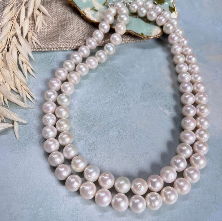 No other gem conveys more warmth and eternal love as much as a pearl, making this pearl necklace ideal as gift for a loved one that likes to make a statement. A fun alternative to a classic round pearl, these pearls still have the timeless style, but with a twist.  Pearls have the magical ability to illuminate skin tone and make an elegant statement, you always look your best when wearing pearls! These will look equally fantastic in a shirt collar as they will on a glamorous night night and will Classic Double Strand Pearl Pendant Necklace, Classic Double Strand Pearl Necklace With Pendant, Classic Double Strand Pearl White Necklace, Pearl White Double Strand Akoya Pearl Necklace, Double Strand Akoya Pearl Necklace In Pearl White, Pearl White Akoya Pearl Double Strand Necklace, Double Strand Pearl White Necklace With Pearl Pendant, Double Strand Pearl Pendant Necklace In White, White Double Strand Pearl Necklace For Anniversary