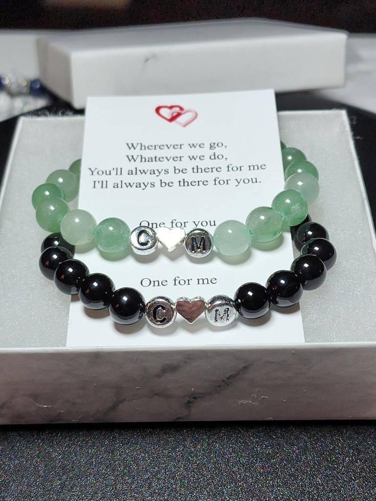 "Personalized set of gemstone bracelets for couples Remind yourself of the special relationships you have with those that you adore with these inital couples/distance bracelets. Each set comes in a complimentary gift box with a note that reads: \"Wherever we go, Whatever we do, You'll always be there for me I'll always be there for you. One for you One for me\" Perfect for gift giving ; Christmas, Valentine's day, Birthday, long distance relationships or just friendships Bracelets are made with high quality, AAA grade genuine natural semi-precious 8mm gemstones, and include a magnetic clasp to attach to one another.  2 initial beads separated by a small heart bead. (specify the two initials in the personalization)   Your choice of gold or silver settings Available in several sizes.  Measur Personalized Black Couples Jewelry, Personalized Black Jewelry For Best Friend Gift, Black Couples Jewelry Gift, Black Couples Bracelet Jewelry, Couples Black Bracelets For Best Friend Gift, Black Couples Bracelets For Best Friend Gift, Elegant Black Name Bracelet For Gift, Elegant Black Name Bracelet As Gift, Black Couples Bracelets For Anniversary