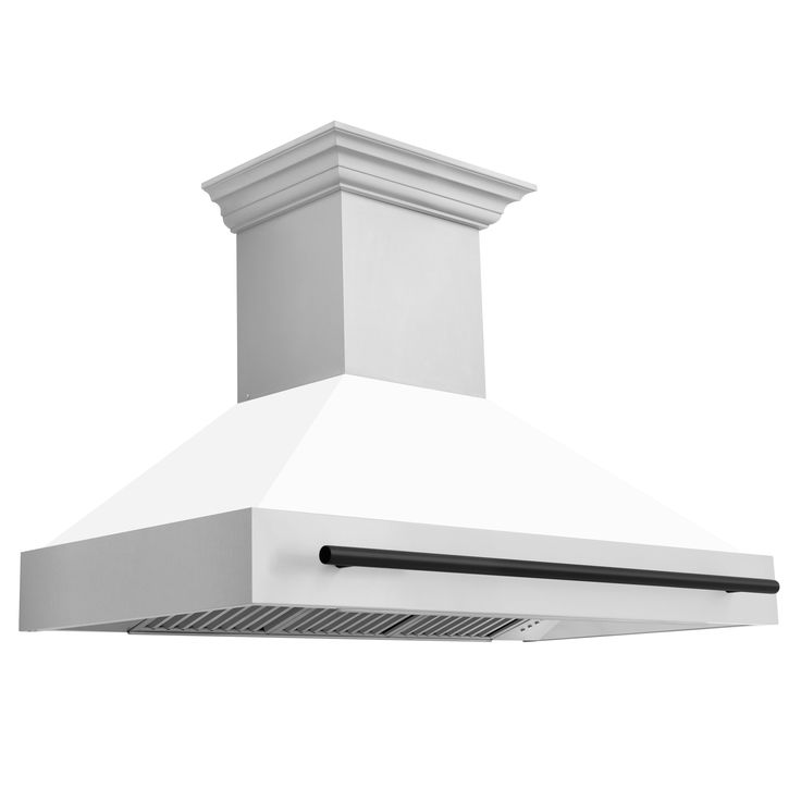 a white stove top oven sitting on top of a metal grill range hood with an exhaust fan