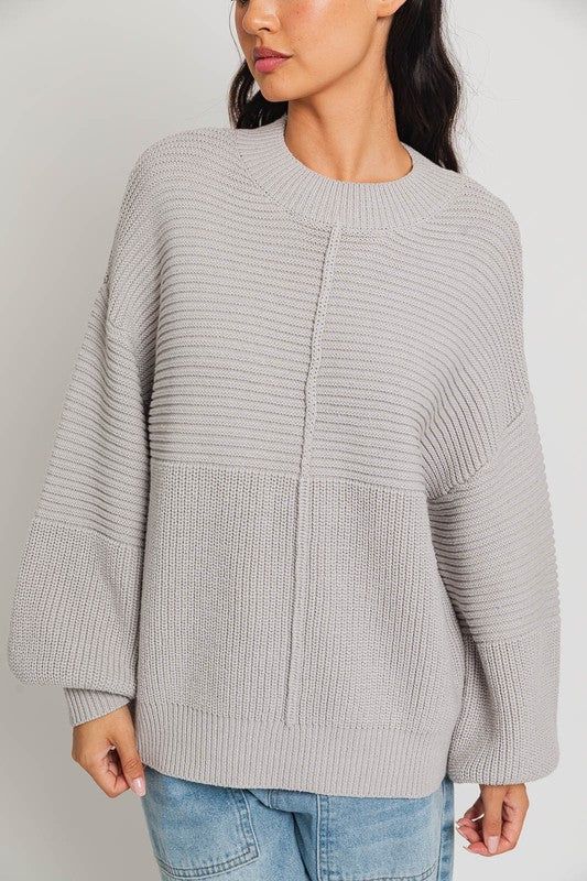 Our Ribbed Knitted Sweater is the ideal wardrobe piece for the winter season. Its banded cuffs and balloon sleeves provide fashion-forward flair, while its ribbed knit texture provides a slimming silhouette to flatter any figure. Sweater has an intentionally oversized, relaxed fit. Model is wearing a small. Recommended sizing 0-2 XS, 4-6 S, 6-8 M, 10-12 Solid V-neck Sweater With Ribbed Cuffs, Fall Wool V-neck Sweater With Ribbed Cuffs, Ribbed Stretch V-neck Sweater, Luxury Long Sleeve Ribbed V-neck Sweater, Elegant Stretch Ribbed V-neck Sweater, Trendy Balloons, Sweater Fits, Ribbed Knit Sweater, Judy Blue Jeans