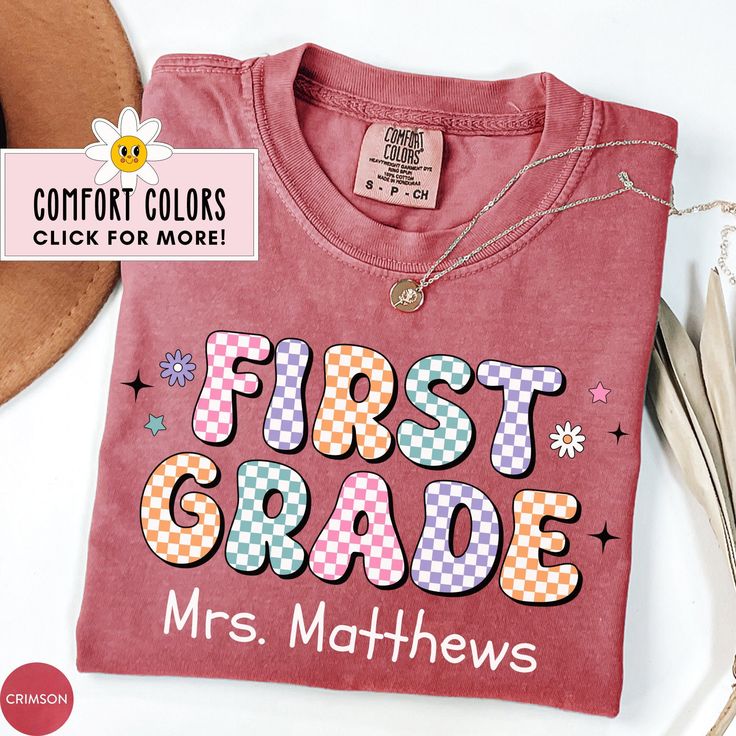 This Personalized First Grade Teacher Shirt is the perfect custom back to school shirt for the kindergarten team! Our Comfort Colors tees are super soft, DTG printed (printed with ink), and 100% cotton. ❗❗There may be a slight difference in the colors due to different monitors. ❗❗ 🌞 HOW TO ORDER 🌞 * Select your size and color from the drop-down menu * Add your shirt to cart. If you would like more than one, add each one to cart individually. * Proceed to check out! * Your shirt will be ready t Multicolor Letter Print T-shirt For School Events, Customizable Crew Neck School T-shirt, Name Print T-shirt For Daycare With School Spirit, Customizable Cotton T-shirt For College, Customizable Cotton T-shirt For Back To School, Cute Red T-shirt For School, Customizable Cotton T-shirt For School, Customizable Cotton T-shirt For School Spirit, Customizable School Spirit Red T-shirt