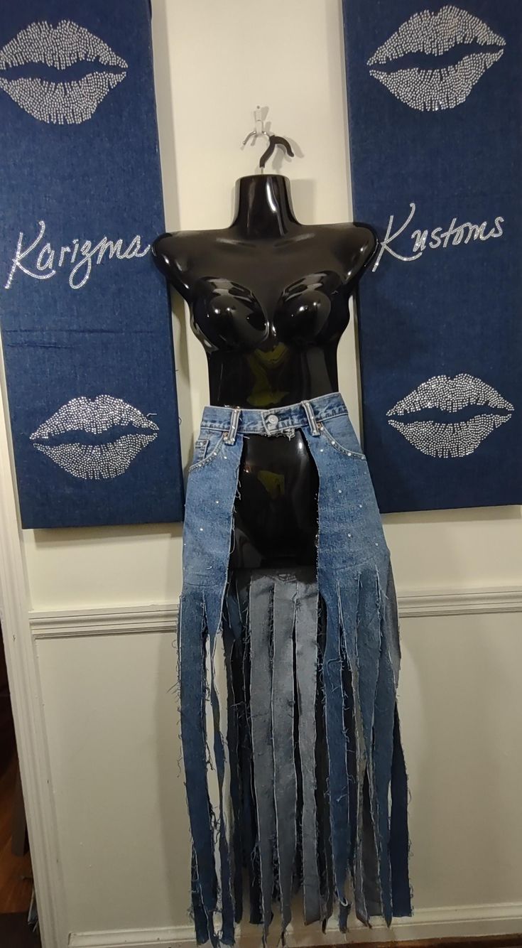 a mannequin wearing a skirt made out of jeans