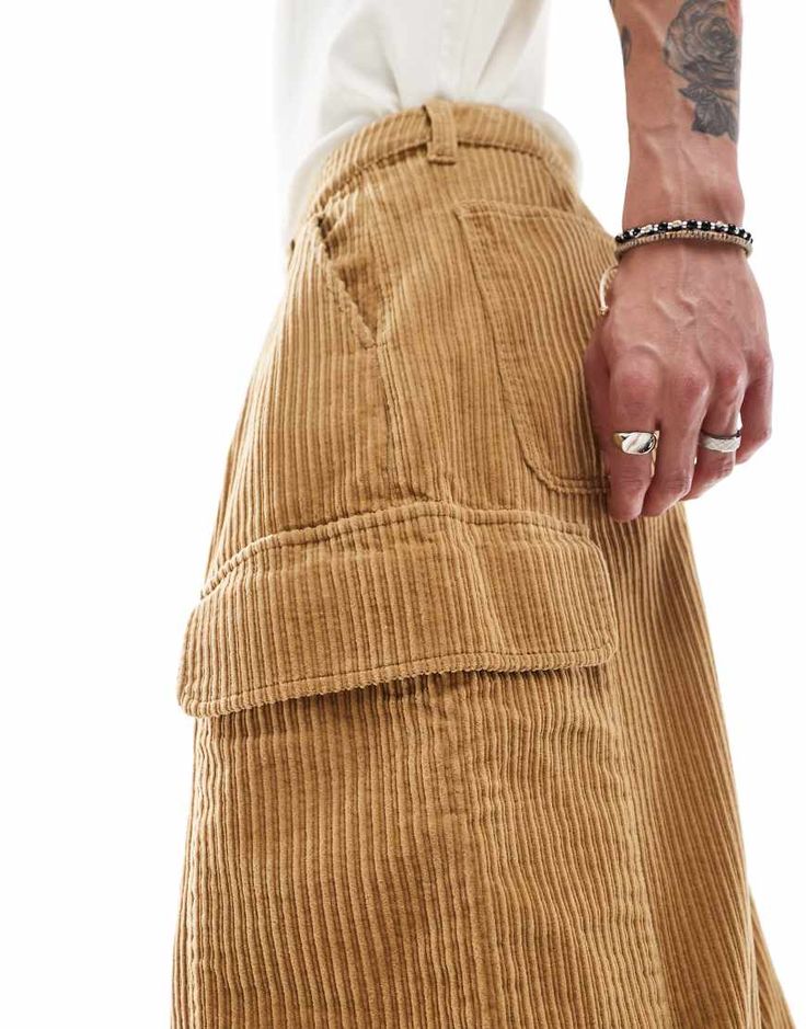 Suit pants by ASOS DESIGN For days when denim won't do Regular rise Belt loops Functional pockets Oversized, tapered fit Baggy Corduroy Cargo Pants, Brown Cargo Pants With Pockets For Spring, Baggy Brown Bottoms With Patch Pockets, Streetwear Brown Bottoms With Patch Pockets, Brown Streetwear Bottoms With Patch Pockets, Brown Bottoms With Patch Pockets For Streetwear, Wide Leg Corduroy Cargo Pants, Wide Leg Corduroy Cargo Pants With Pockets, Wide-leg Corduroy Cargo Pants With Pockets