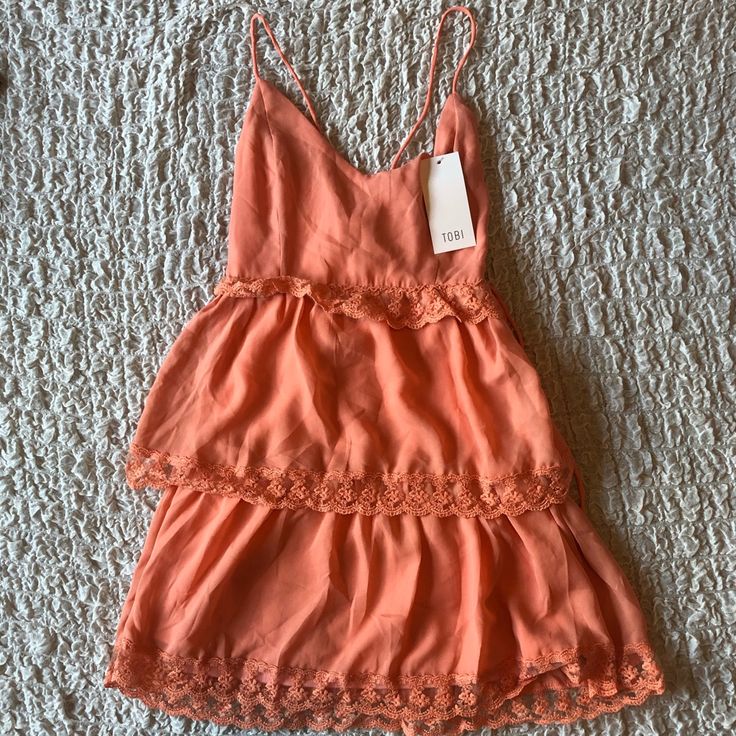 Nwt. Peach, Ruffle, Lace Detail, Lace Up Back Feminine Orange Mini Dress For The Beach, Feminine Orange Beach Mini Dress, Apricot Mini Dress For The Beach, Apricot Mini Dress For Beach, Orange Tiered Beach Dress, Sleeveless Apricot Mini Dress With Ruffles, Orange Sleeveless Dress With Lace Trim, Orange Summer Dress With Lace Trim, Summer Orange Dresses With Lace Trim