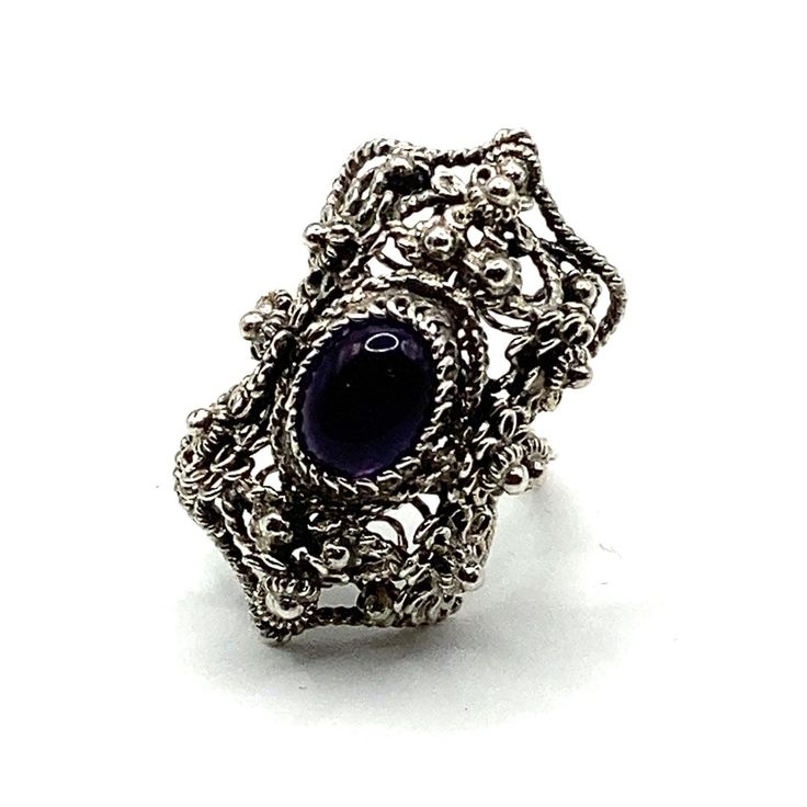 This ring is one of our new vintage collection items I discovered recently from another part of my family. The ring is a handmade filigree work from one of our family master jewelers and was revived in order to present this exceptional art. It was reconditioned and updated with a new Amethyst stone. The entire ring is hand made with filigree techniques used by my families filigree masters. The material used is sterling silver (925). This ring symbolizes the night on Adriatic beaches. Size: 5.5 L Vintage Sterling Silver Filigree Ring With Intricate Design, Vintage Sterling Silver Filigree Ring, Ornate Handmade Collectible Rings, Vintage Purple Sapphire Gemstone Ring, Antique Ring With Intricate Design For Gift, Purple Oval Filigree Rings, Purple Oval Ring With Intricate Design, Oval Purple Ring With Intricate Design, Ornate Oval Amethyst Ring