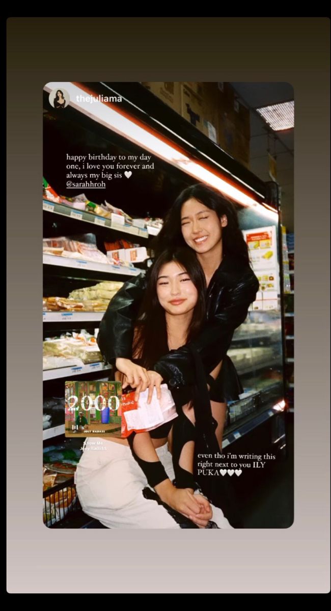 two young women standing next to each other in front of a store shelf with food