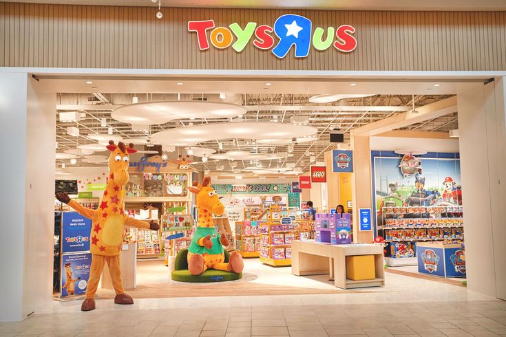 toys r us store with two giraffes in front