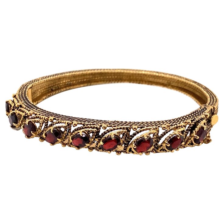 Vintage 14K Yellow Gold Garnet Bangle Bracelet - The bracelet contains 9 oval garnets that measure 6 x 4mm. The width of the bangle is 8.5mm and tapers down to 5mm and has oxidation on the side. The bracelet weighs 23.44 grams. Vintage Bracelet, Bracelets And Charms, Vintage Watches, Bangle Bracelet, Antique Jewelry, Vintage Antiques, Garnet, Gemstone Jewelry, Cool Things To Buy