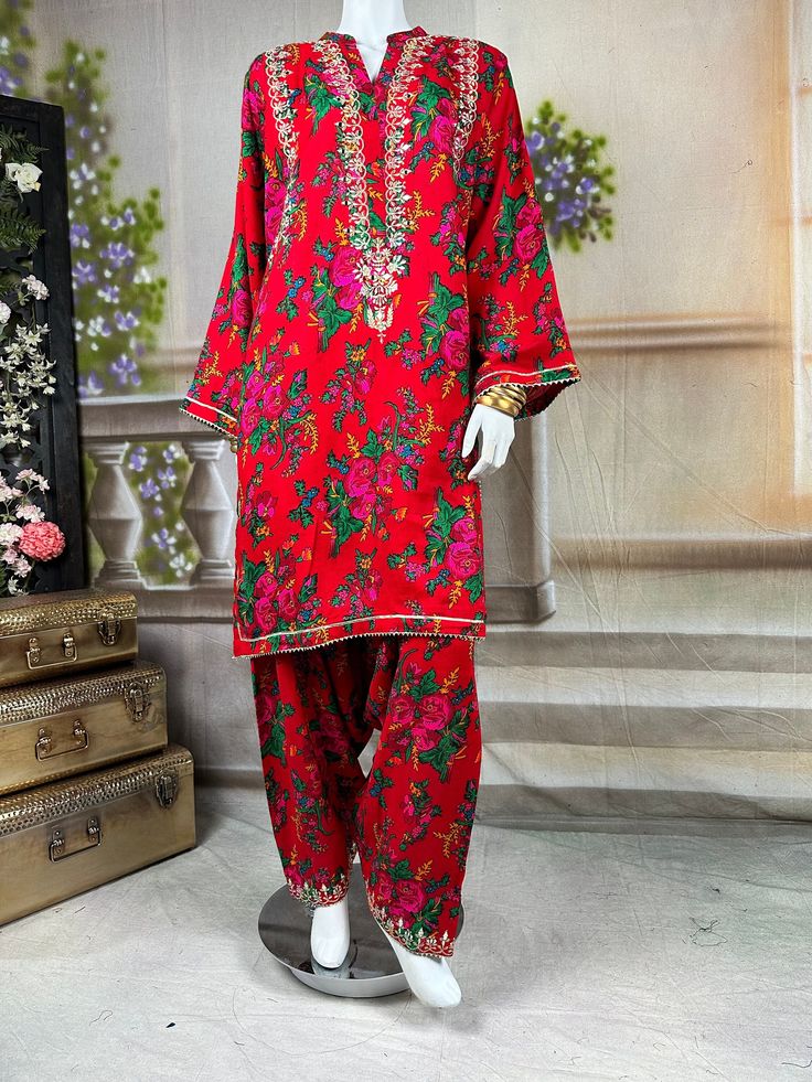 Embrace the vibrant cultural heritage of Sindh with this exquisite kurta salwar set. This kurta and salwar is adorned with intricate tilla embroidery, showcasing delicate gold threads that form traditional motifs. Complementing the tilla work are sparkling mirror embellishments, adding a touch of glamour and shimmer to the ensemble. The dress, crafted from soft, comfortable cotton fabric, provides a perfect balance of tradition and modern elegance. Ideal for festive occasions and cultural celebr Festive Straight Kurta Palazzo Set In Shantoon, Festive Shantoon Palazzo Set With Straight Kurta, Unstitched Traditional Palazzo Set With Dabka Work, Traditional Drape Cambric Sharara With Dabka, Traditional Drape Sharara In Cambric With Dabka, Eid Sharara With Printed Motifs In Mulmul, Eid Sharara With Printed Motifs, Traditional Semi-stitched Dresses With Printed Motifs, Traditional Sharara With Printed Motifs For Eid