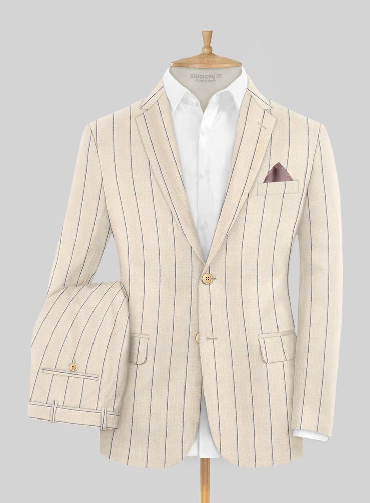 Introducing our Noble Rosaria Cream Stripe Cotton Silk Linen Suit, where classic elegance meets modern flair, offering an aura of sophistication. This authentic suit is meticulously crafted from a premium blend of cotton, silk, and linen, delivering a texture that is marvelously smooth and soothing to the touch. Its design features elegant blue stripes on a cream background, creating a dynamic and visually striking impression. Making it the ideal choice for making a memorable entrance at exotic Timeless Beige Linen Suit, Luxury Beige Suits, Elegant Linen Blazer For Business, Luxury Beige Single-breasted Suit, Luxury Linen Suits, Luxury Linen Suits For Workwear, Elegant Linen Blazer For Tailoring, Elegant Linen Suits With Notch Lapel, Classic Beige Set With Suit Collar