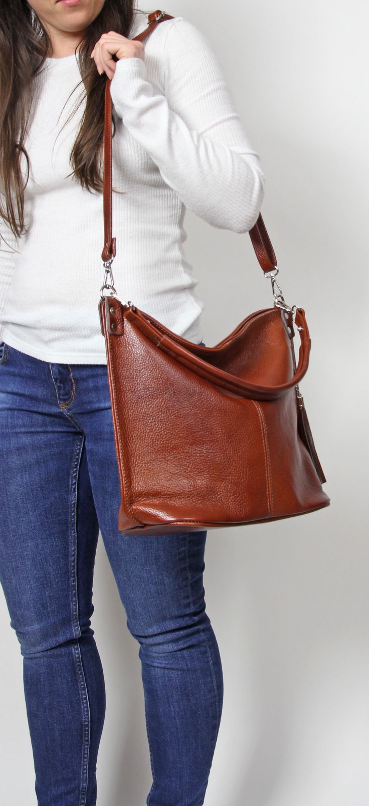 Everyday Leather Bag with zipper and lining, Brown Women Leather Hobo Bag, Brown leather bag This medium-sized brown leather handbag is made of Italian natural grain leather. The interior is lined with one larger pocket and the other smaller on the phone The outside purse has an additional pocket for handy items. A long adjustable strap with Aztec pattern is attached to the bag, to be worn as a crossbody. To return to my shop, simply click here: https://www.etsy.com/shop/BarbaraLeatherDesign Dim Cognac Soft Leather Crossbody Hobo Bag, Brown Business Hobo Bag With Detachable Strap, Brown Hobo Bag With Adjustable Strap For Business, Brown Business Hobo Bag With Adjustable Strap, Brown Bucket Bag With Zipper And Top Handle, Brown Bucket Bag With Top Handle And Zipper Closure, Cognac Hobo Shoulder Bag For Business, Brown Crossbody Bucket Bag For Business, Brown Top Handle Bucket Bag With Zipper Closure