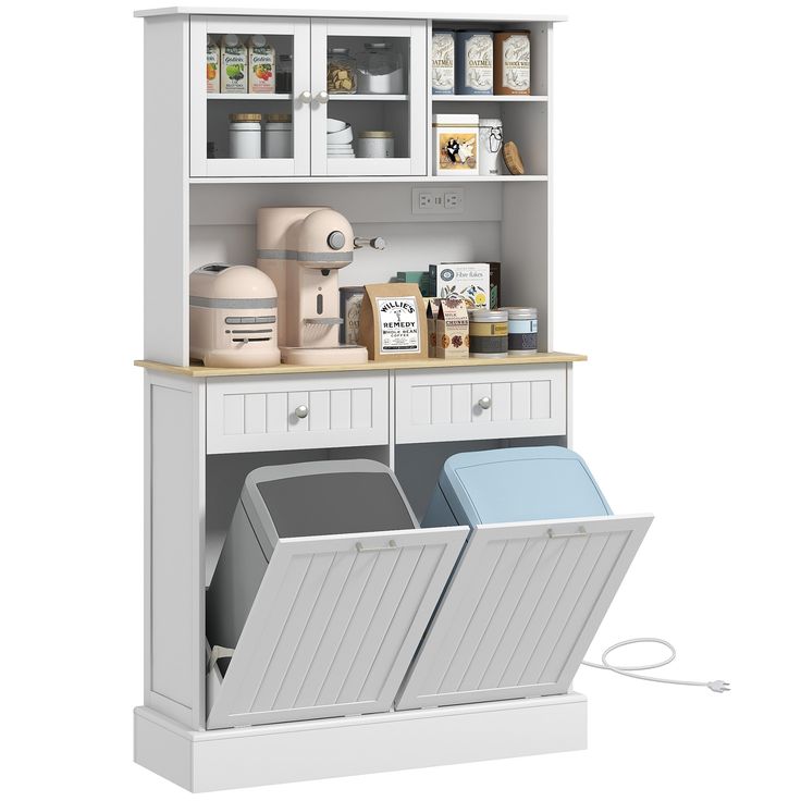 an open cabinet with two trash cans and other items in it on top of the shelf