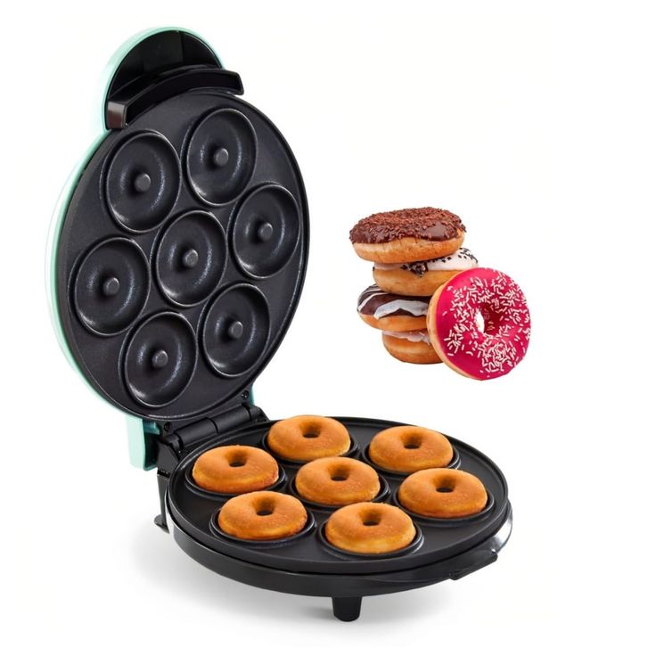 an electric donut maker with six donuts in it's pancake tray