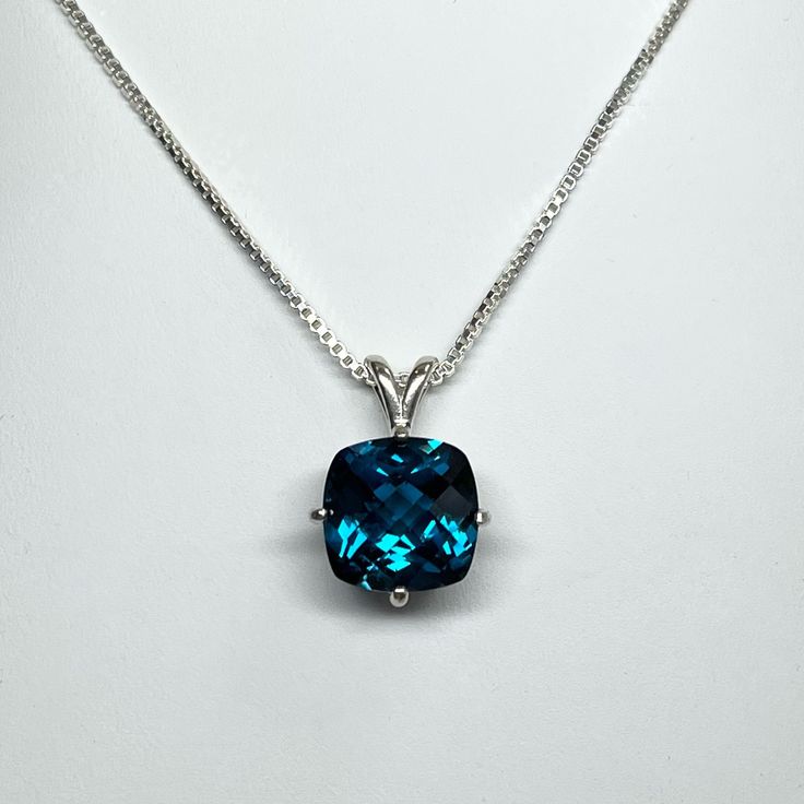 "Gorgeous London Blue Spinel Necklace * Select stone size 8mm (2.3ct) or 10mm (4ct) Cushion Cut London Blue Spinel * Solid 925 Sterling Silver * 16\" or 18\" Sterling Silver chain included Hallmarked & Gift Ready! This Spinel is Laboratory Grown. It is identical to the natural stone in every way, including Chemistry, Composition and Hardness with flawless clarity and excellent color refraction. TIMELESS, BEAUTIFUL & UNIQUE FINE ART JEWELRY" Classic Blue Necklace With Accent Stones, Classic Blue Necklaces With Accent Stones, Classic Blue Gemstone Necklace, Blue Diamond Cut Round Stone Jewelry, Blue Round Stone Diamond Cut Jewelry, Blue Diamond Cut Jewelry With Round Stone, Classic Blue Round Pendant Necklace, Blue Diamond Cut Round Cut Necklaces, Classic Blue Birthstone Necklace