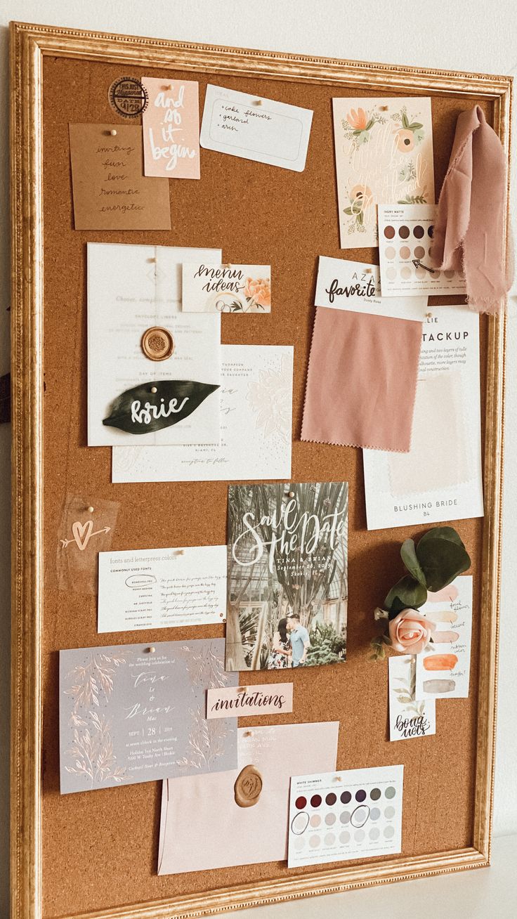 a cork board covered in lots of different items