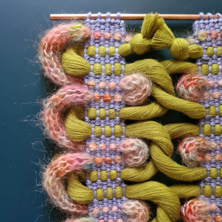 two skeins of yarn sitting on top of each other