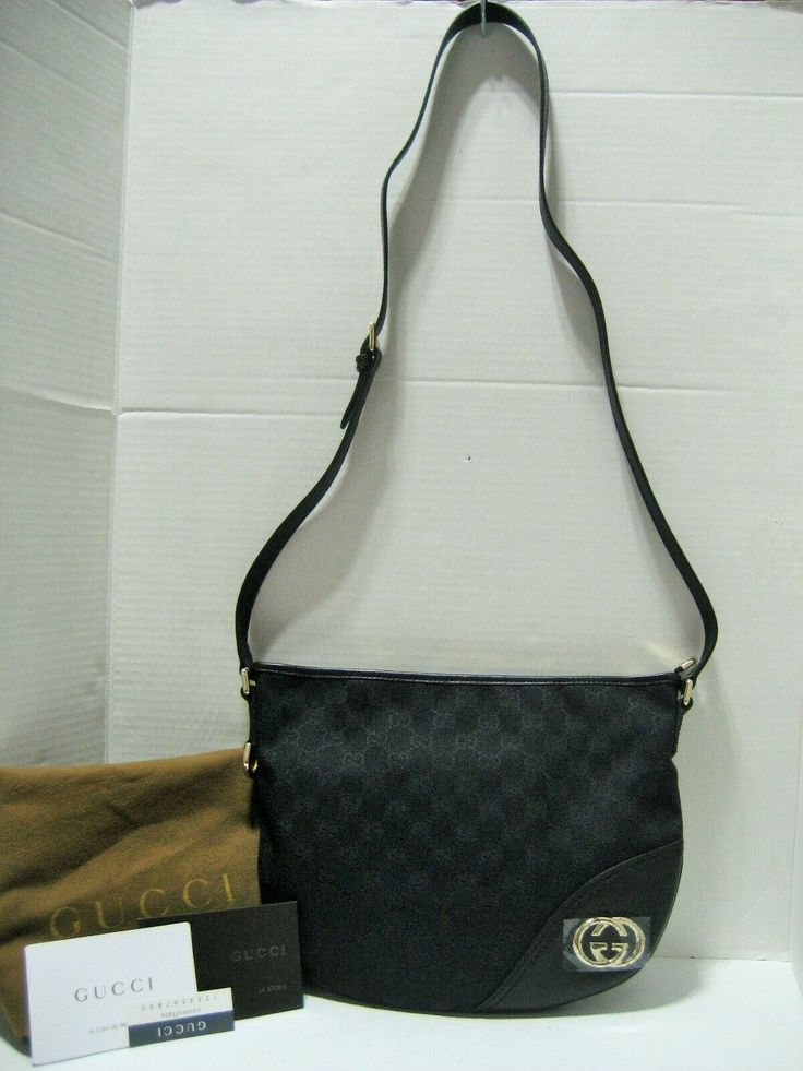 Authentic High End Designer Clothes, Handbags, Shoes, Accessories and Jewelry at Affordable Prices! Always, 100% Authentic Guarantee or 110% Money Back! Since 2001 Fast Shipping-30 Day Hassle Free Returns   New With Tags and Dust Bag Gucci Black GG Motif Logo Canvas with Black Leather Trim Half-Moon Crossbody Bag With Silvertone/Light Goldtone GG Hardware and Zip Top Closure  MADE IN ITALY Approx.  11.5"(Top) W x 9" W x 2" D Adjustable Shoulder Strap: 19" -21" Drop  This gorgeous, iconic Gucci signature GG motif black canvas with black leather trim cross-body bag, silvertone/light goldtone hardware in a half-moon design, a popular Gucci model since the late '50s. This timeless messenger crafted in GG Supreme canvas with leather trimmed and features a double G logo on front. Durable, comfor Bag Gucci, Messenger Handbags, Gucci Models, Silver Logo, Classic Bags, Gucci Black, Leather Silver, Black Canvas, Medium Bags