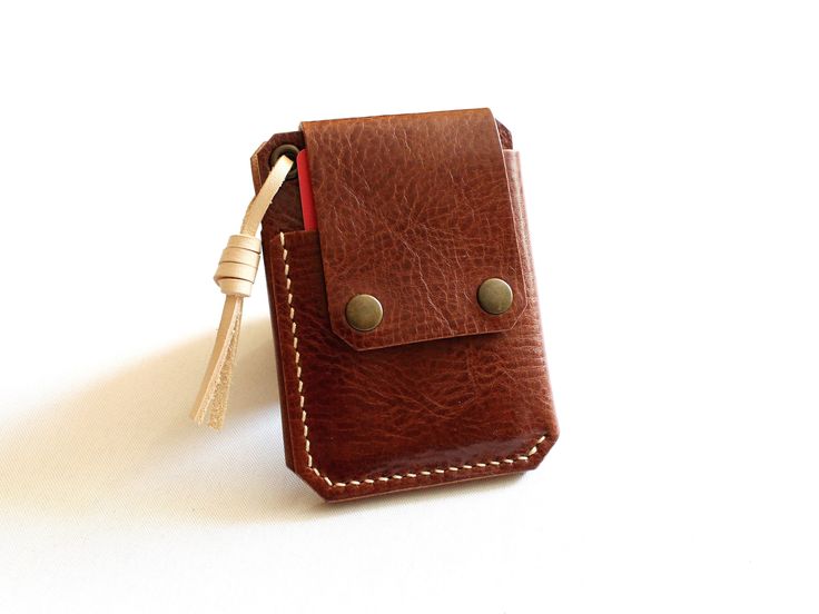 This wallet is designed and made by hand from Italian full grain leather in gorgeous chestnut brown and whiskey color,  -  beautiful and durable! Minimalist in design and slim in shape, this leather wallet is crafted to fit all the essentials without being bulky or taking up too much space.   Makes an amazing gift.  DESCRIPTION: ➣ Size:  3.15" wide, 4.15" tall //  8 cm wide, 10.5 cm tall ➣ Material: Italian full grain leather ➣ Colour: Whiskey, Chestnut Brown ➣ Three compartments: 2 card slots and a cash pocket  ➣ Easy access to your bills and cards ➣ Convenient front card slot for quick access ➣ Best fits 6-8 credit or business cards and up to 10 folded bills ➣ Secure pocket for AirTag ➣ Perfect combination of innovation and fashion  ➣ Antique bronze hardware reinforcements *Please note t Brown Waxed Finish Wallets For Everyday Carry, Brown Leather Trifold Wallet With Waxed Finish, Handmade Brown Wallet For Everyday Carry, Brown Rectangular Wallet With Waxed Finish, Brown Trifold Wallet With Leather Patch For Everyday, Brown Trifold Wallet With Leather Patch, Brown Leather Patch Trifold Wallet For Everyday, Brown Rectangular Trifold Wallet With Waxed Finish, Cognac Wallet With Interior Card Slots For Gift