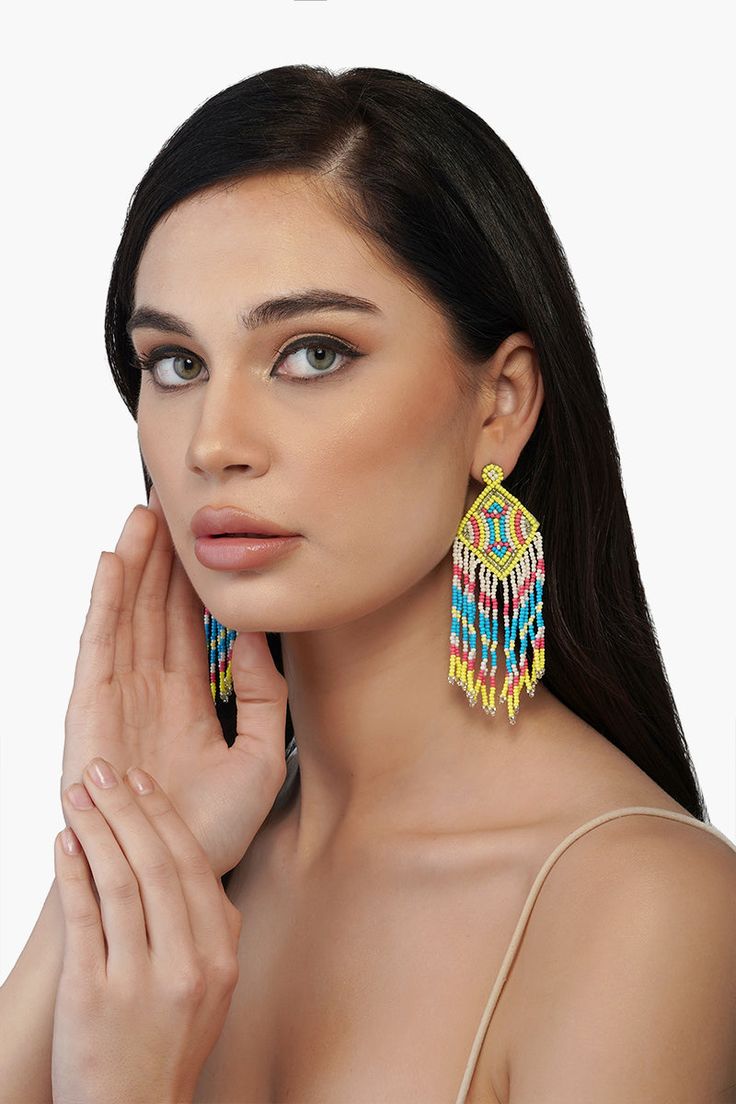 Every winter and Spring'22 runway has focused on this particular trend- The drop earrings! One of the most universally flattering ways to accessorize, we are loving the Neon Lights Earrings this season. Hand beaded with vibrant shades of green, turquoise and coral. They will make every outfit come alive dancing to your every move. Hand crafted by skilled artisans from India, they feature bead fringes detail. Style it with happy dresses and easy outfits alike to go from day to night. Beautiful Ni Multicolor Drop Earrings For Party, Trendy Beach Earrings With Colorful Beads, Trendy Summer Chandelier Drop Earrings, Trendy Turquoise Beaded Earrings, Trendy Multicolor Beaded Earrings For Summer, Trendy Festive Drop Earrings, Vibrant Beach Earrings, Colorful Beaded Drop Earrings For Summer, Colorful Drop Earrings For Beach