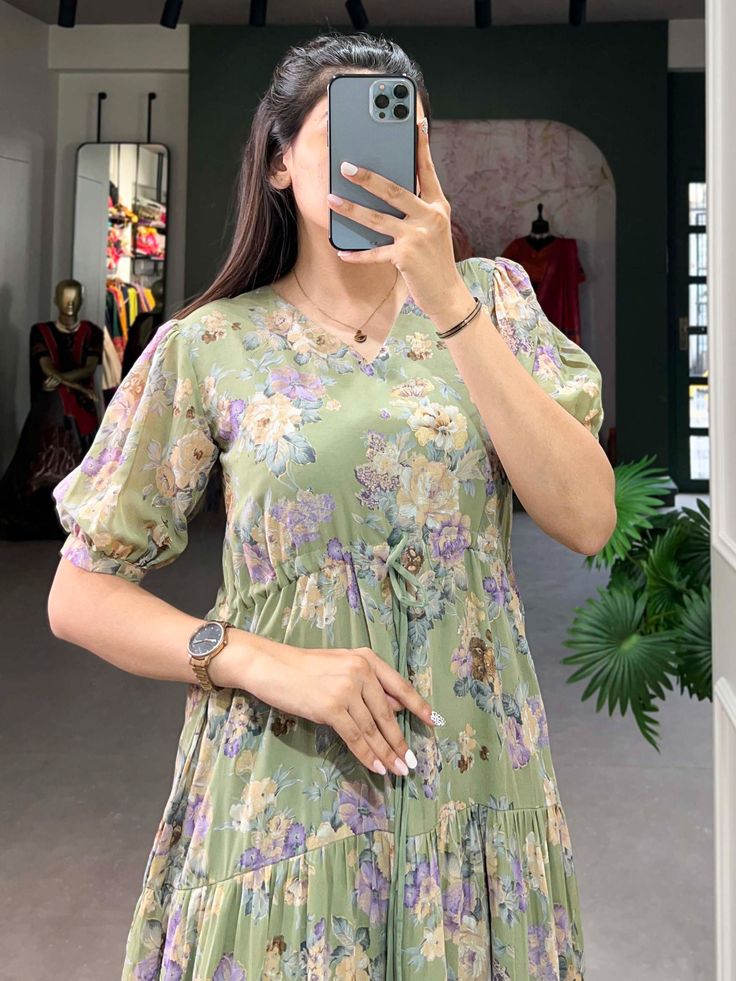 This pista green georgette frock dress with floral prints is a versatile and elegant addition to any wardrobe. Its timeless design, paired with the contemporary appeal of floral prints, makes it suitable for a wide range of occasions. 
This exquisite dress is crafted from premium georgette fabric, offering a soft and flowing silhouette that enhances every body type. Available in sizes XS to L, this fully stitched frock dress ensures a perfect fit, combining comfort with style.
The pista gre Summer Green Floral Print Chiffon Dress, Green Chiffon Dress For Garden Party, Green V-neck Floral Print Dress, Green Floral Print Mini Dress With Short Sleeves, Green Chiffon Floral Print Dress, Green Chiffon Midi Dress With Floral Print, Green Floral Print Chiffon Maxi Dress, Green Floral Print Chiffon Dress For Garden Party, Green Knee-length Chiffon Dress For Spring