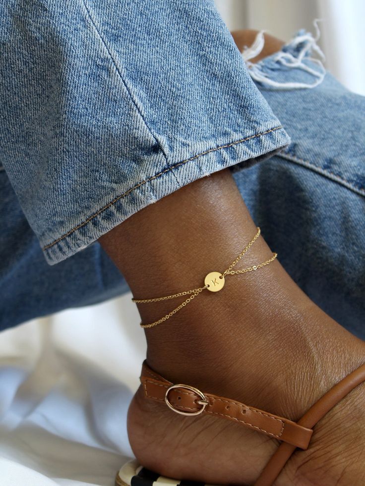 Minimal and dainty, our Lola anklet is perfect for personalization with your initial or the initial of a loved one. This design features duo cable chains - one just a touch longer than the other - in order to achieve a cascading, layered look that is unique and stylish! Made of high quality 14k gold fill or sterling silver, this anklet will shine all summer and every season after - the perfect way to make sure your style stays one step ahead. This listing is for one [1] anklet. | MATERIAL * Gold Trendy Adjustable Ankle Wrap Jewelry, Adjustable Gold Minimalist Anklet, Adjustable Minimalist Gold Anklet, Minimalist Anklets For Gift, Personalized Adjustable Elegant Anklet, Elegant Personalized Adjustable Anklet, Adjustable Anklets For Gift, Personalized Adjustable Dainty Anklets, Personalized Dainty Adjustable Anklets