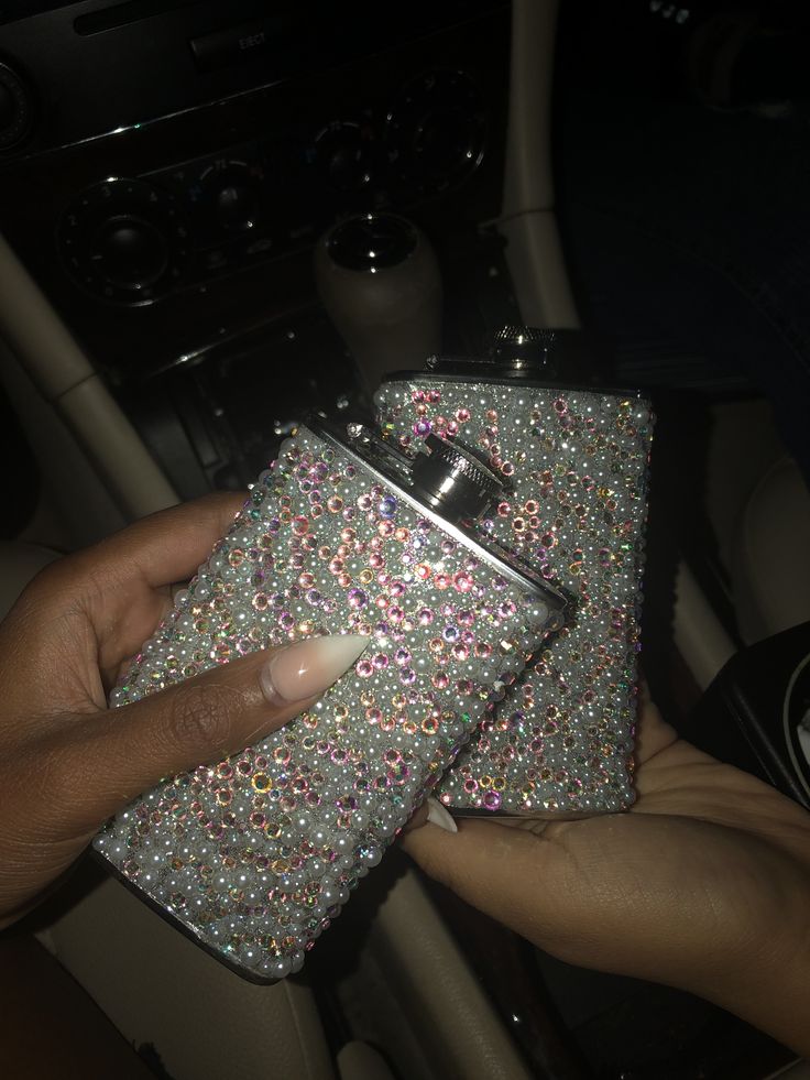 a person holding onto a purse with lots of sprinkles on it