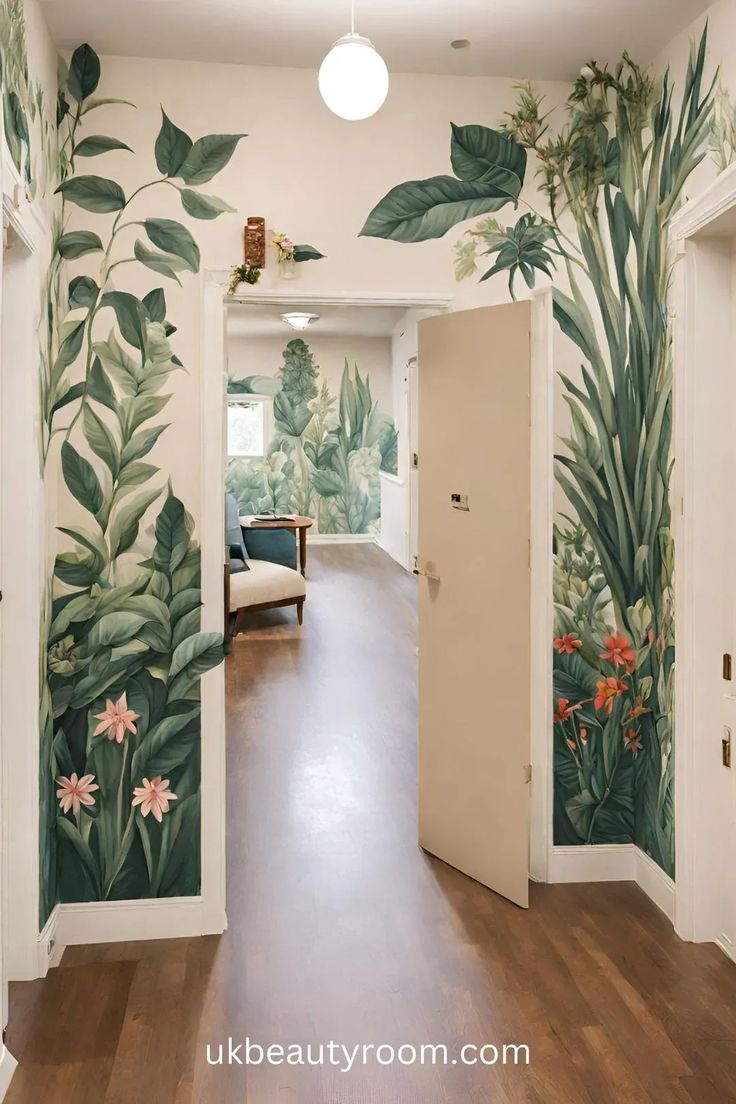 an open door leading to a hallway with green leaves and flowers painted on the walls