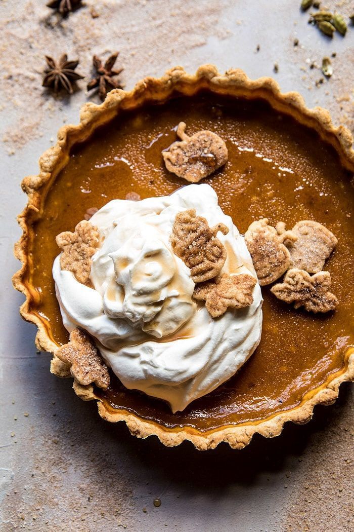 a pie topped with whipped cream and cookies