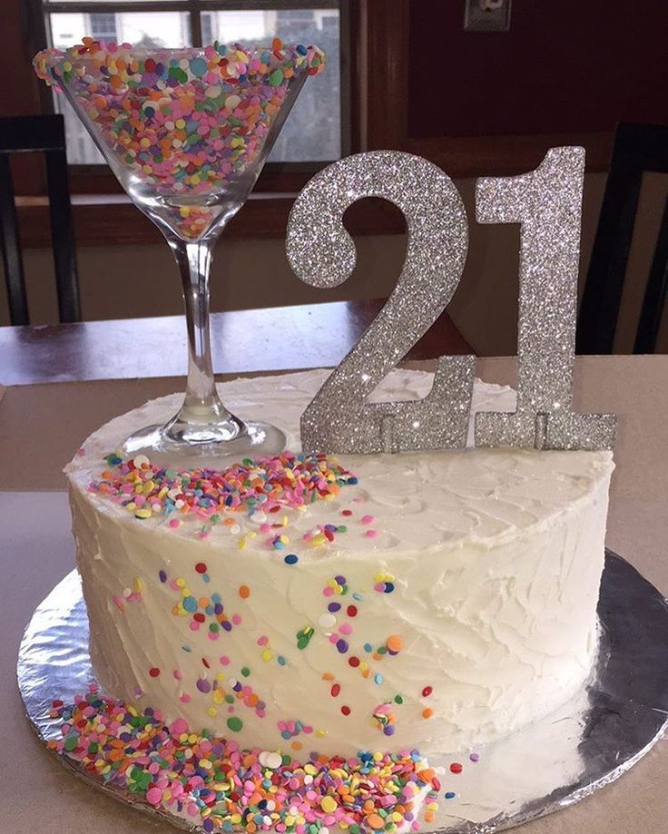 a 21st birthday cake with sprinkles and a martini glass