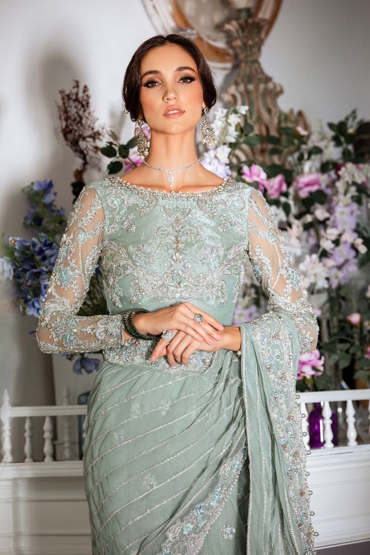 Pakistani Bridal Outfit in Premium Net Saree Style is an elegant attire that will give the bride a unique elegant look on the big day. Bridal Saree is emblazoned with embroidery, tilla, sequins, beads, and silverwork, making it a perfect choice to have a stylish look at the wedding. Embellished Blouse: The beautiful blouse in premium net fabric has an alluring sea-green shade. This perfectly stitched net blouse is adorned with hand-crafted details of embroidery, tilla, sequins, and pearls, givin Net Blouse, Net Blouses, Saree Style, Elegant Attire, Bridal Outfit, Embellished Blouse, Net Saree, Net Fabric, Beautiful Blouses