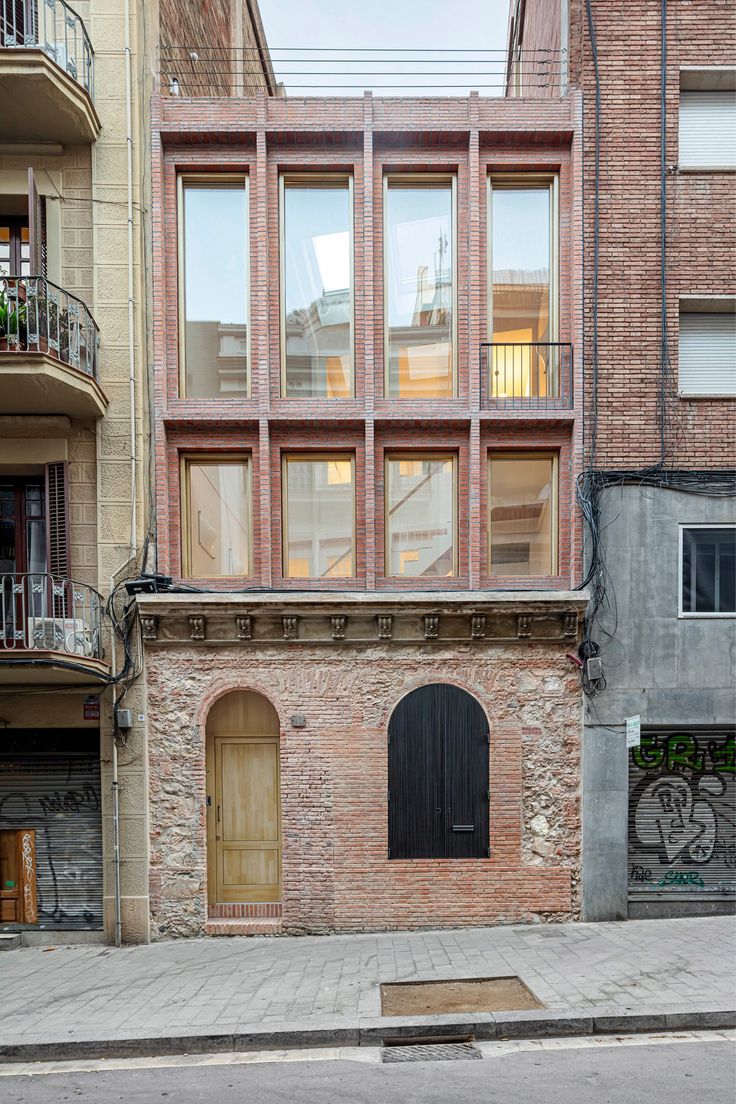 an old brick building with lots of windows