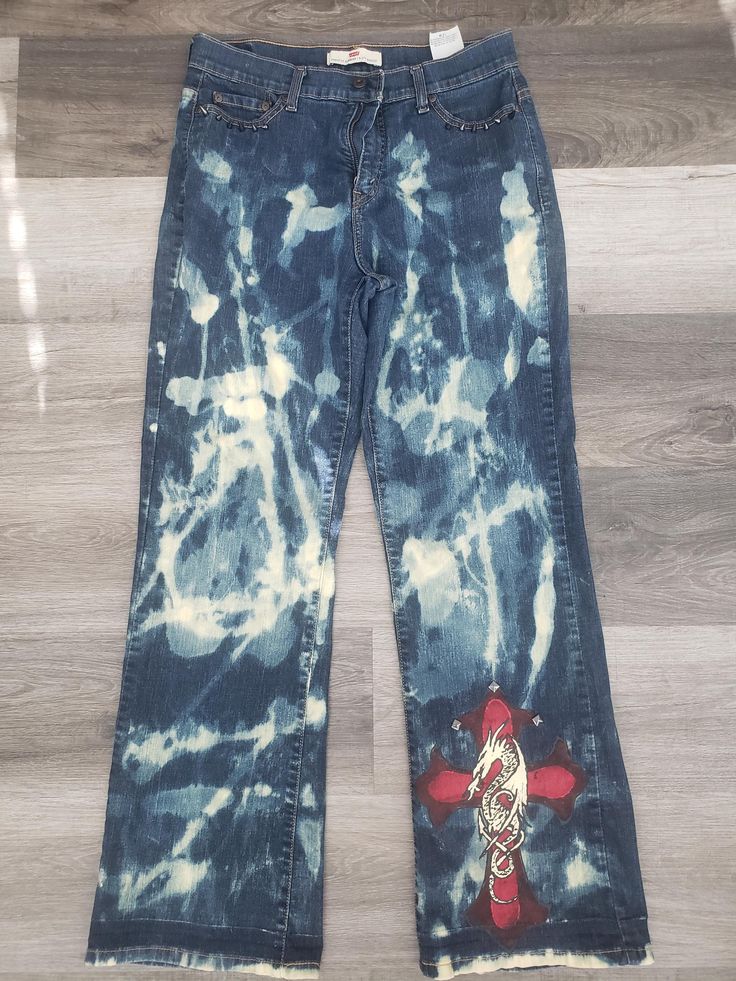 One of a kind Levi's bleached, hand painted and distressed medium washes jeans. These jeans are comfortable and a perfect fit! They pair perfect with a crop top, bodysuit, T-shirt or crewneck.  SIZE: 12M Summer Distressed Light Wash Flare Jeans, Fitted Cotton Bottoms With Paint Splatter, Summer Light Wash Distressed Flare Jeans, Casual Paint Splatter Bottoms For Summer, Faded Ripped Cotton Flare Jeans, Fitted Distressed Acid Wash Bottoms, Casual Fitted Jeans With Paint Splatter, Medium Wash Distressed Cotton Flare Jeans, Distressed Medium Wash Cotton Flare Jeans