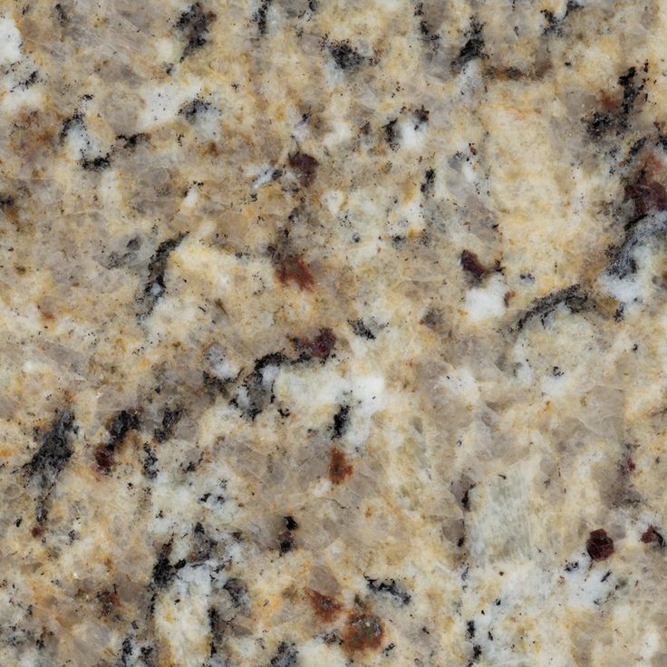 a close up view of the surface of a granite countertop with brown and white speckles