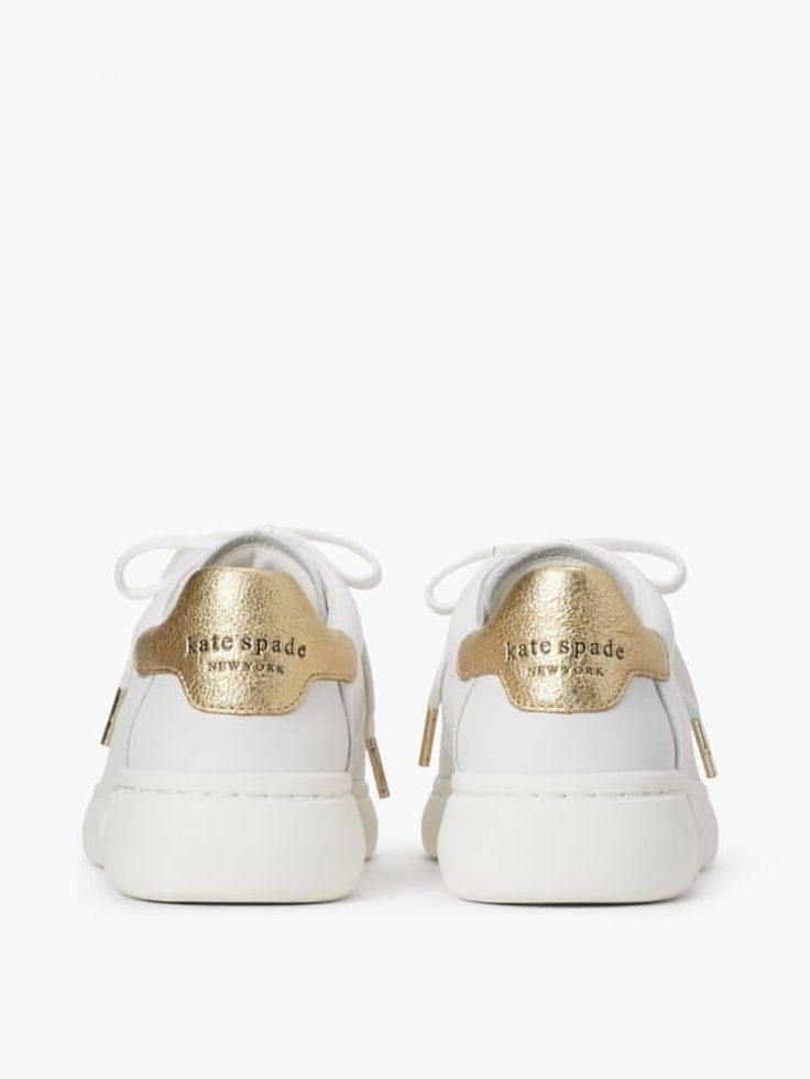 we call these our lift sneakers for a reason: the platform midsoles will add a little bit of height plus the supple nappa leather with pops of print and color will instantly elevate any outfit you pair them with. | Kate Spade Lift Sneakers, Optic White/Pale Gold - 11 Calf Leather Lace-up Shoes With Textured Sole, Leather Lace-up Shoes With White Sole, Gold Leather Sporty Sneakers, Gold Leather Sneakers With Rubber Sole, Elegant Lace-up Sneakers With White Sole, Gold Leather Sneakers With Laces, Lace-up Calf Leather Sneakers, Designer Leather Sneakers With Laces, Gold Leather Sneakers