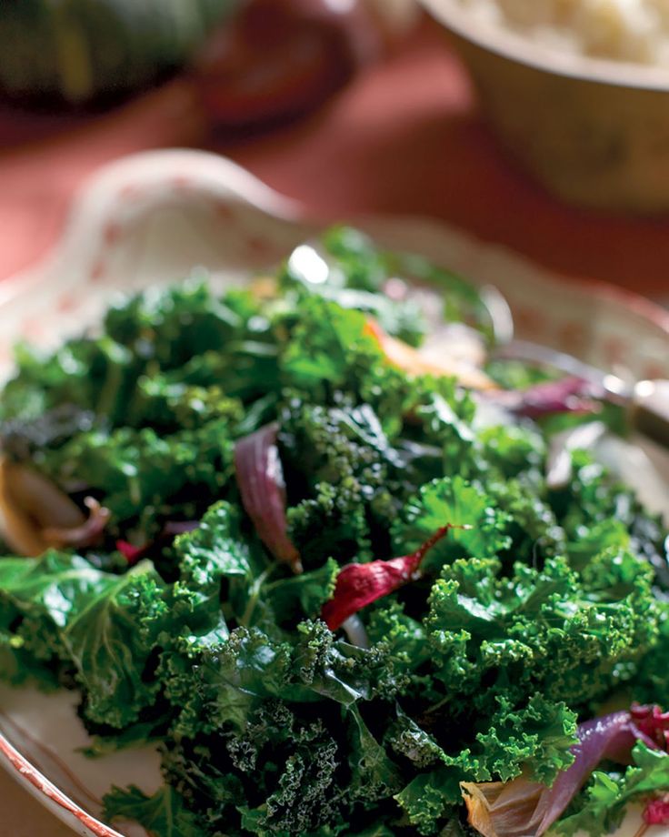 a bowl filled with lots of green vegetables