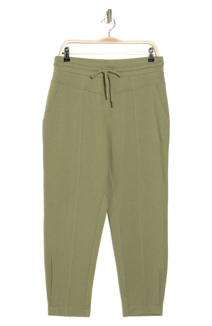 Cool and comfortable in lightweight fabric, these pants have a stretchy waistband for pull-on-and-go ease. 26" inseam; 10" leg opening; 12" front rise; 14 1/2" back rise (size Medium) Elastic/drawstring waist Front slant pockets 63% cotton, 37% polyester Machine wash, tumble dry Imported Casual Green Pants With Elastic Side Panels, Athleisure Ankle-length Pull-on Pants, Stretch Ankle-length Joggers With Elastic Side Panels, Stretch Joggers With Elastic Side Panels, Ankle-length, Casual Stretch Sweatpants For Work, Spring Loungewear Joggers With Pull-on Style, Green Pull-on Pants For Loungewear, Stretch Pull-on Sweatpants For Everyday, Stretch Ankle-length Joggers With Side Pockets