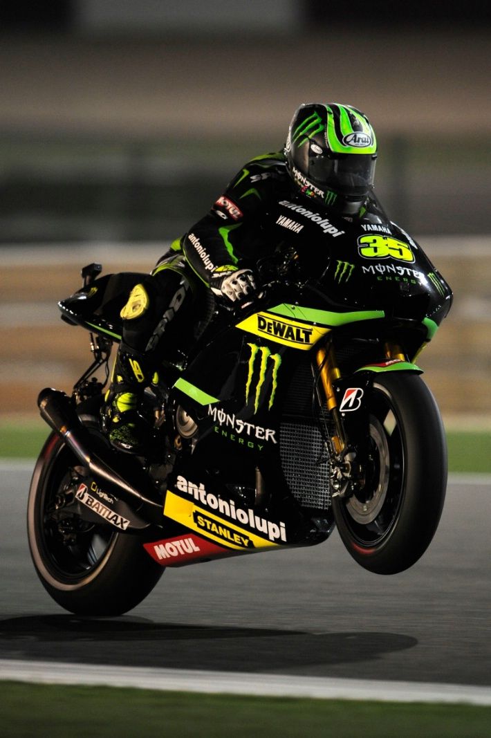 a person riding a motorcycle on a race track