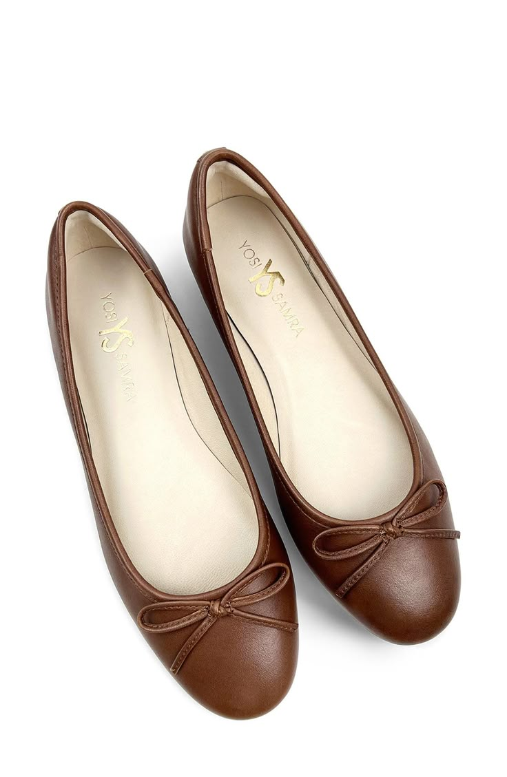 Signature logo hardware and a delicate vamp bow lend luxe elements to a timeless ballet flat set on a cushioned footbed for lasting comfort. Memory foam cushioning with arch support Slip-resistant sole Leather upper and lining/rubber sole Imported Elegant Ballet Flats With Arch Support, Elegant Slip-on Ballet Flats With Arch Support, Elegant Flats With Arch Support And Round Toe, Elegant Ballet Flats With Cushioned Footbed And Round Toe, Elegant Brown Ballet Flats With Removable Insole, Elegant Closed Toe Flats With Arch Support, Elegant Brown Ballet Flats Medium Width, Elegant Brown Ballet Flats With Round Toe, Elegant Brown Round Toe Ballet Flats