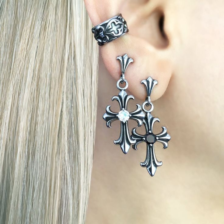 Gothic Cross Earring, a striking piece of jewelry that embodies the essence of gothic style and dark elegance. Crafted with meticulous attention to detail, this earring is designed to make a bold statement and add a touch of mystique to any outfi Cross Earring, Dark Elegance, Gothic Cross, Gothic Crosses, Gothic Earrings, Cuff Rings, Clear Stone, Cross Earrings, Men Earrings