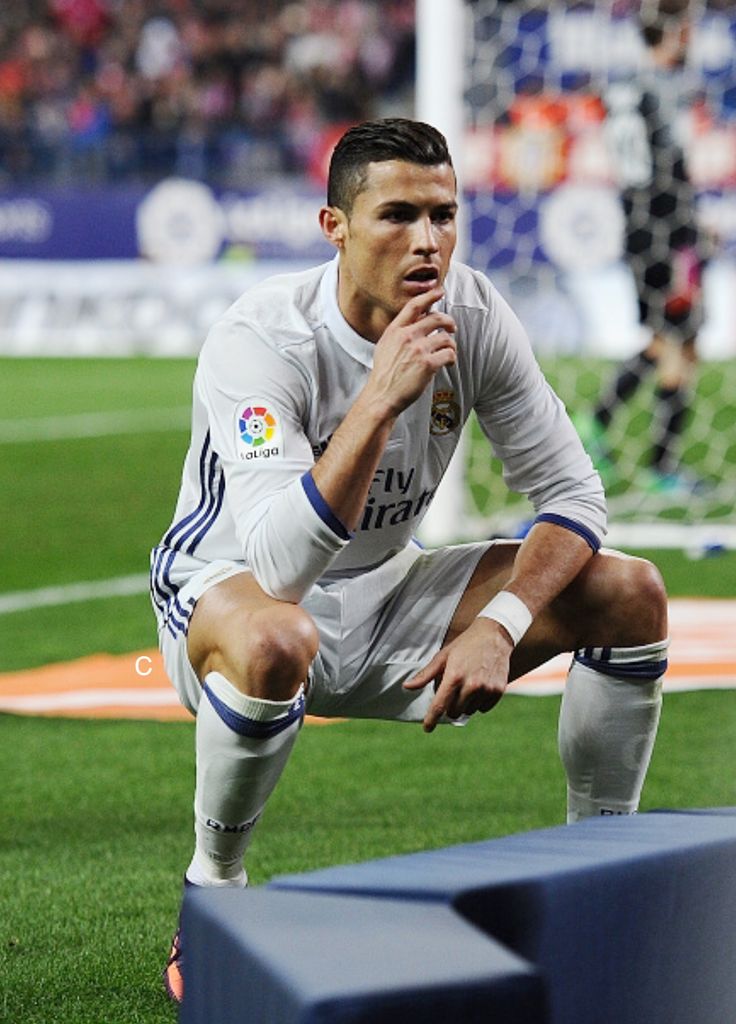 a soccer player kneeling down on the field