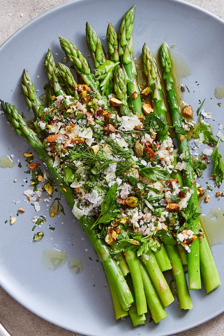 asparagus with almonds and parmesan cheese on a plate