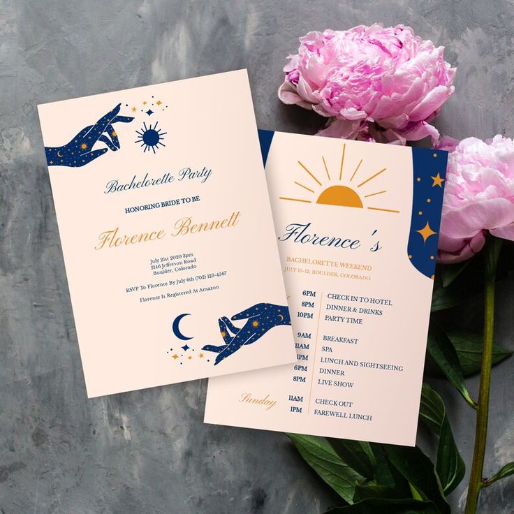 two wedding programs with pink flowers on the table next to it and a blue and gold design