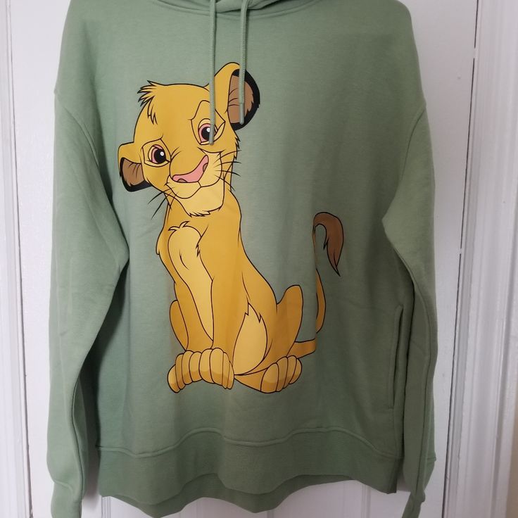 Primark Disney Lion King Pull Over Hoodie Women Size 8/10 Medium. Features Hood With Drawstrings, And Two Side Open Pockets, And Disney Logo. Material Is Polyester 65%/Cotton 35% And Is Machine Washable. Length 25" Pit To Pit 25" Arms 22" Disney Cotton Hoodie With Cartoon Print, Disney Hoodie With Cartoon Print For Winter, Disney Cotton Hoodie With Drawstring, Disney Hoodie For Winter, Disney Cotton Hooded Sweatshirt, Disney Cartoon Print Hoodie For Winter, Disney Cotton Hoodie With Drawstring Hood, Disney Style Winter Hoodie With Cartoon Print, Disney Cartoon Print Winter Hoodie